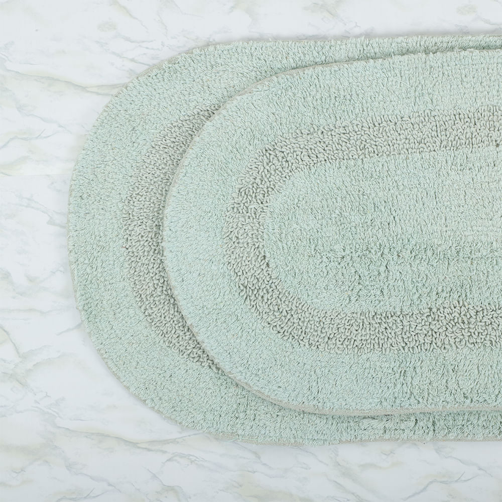 Set de dos alfombras ovaladas de algodón para baño