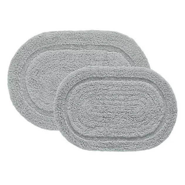 Set de dos alfombras ovaladas de algodón para baño