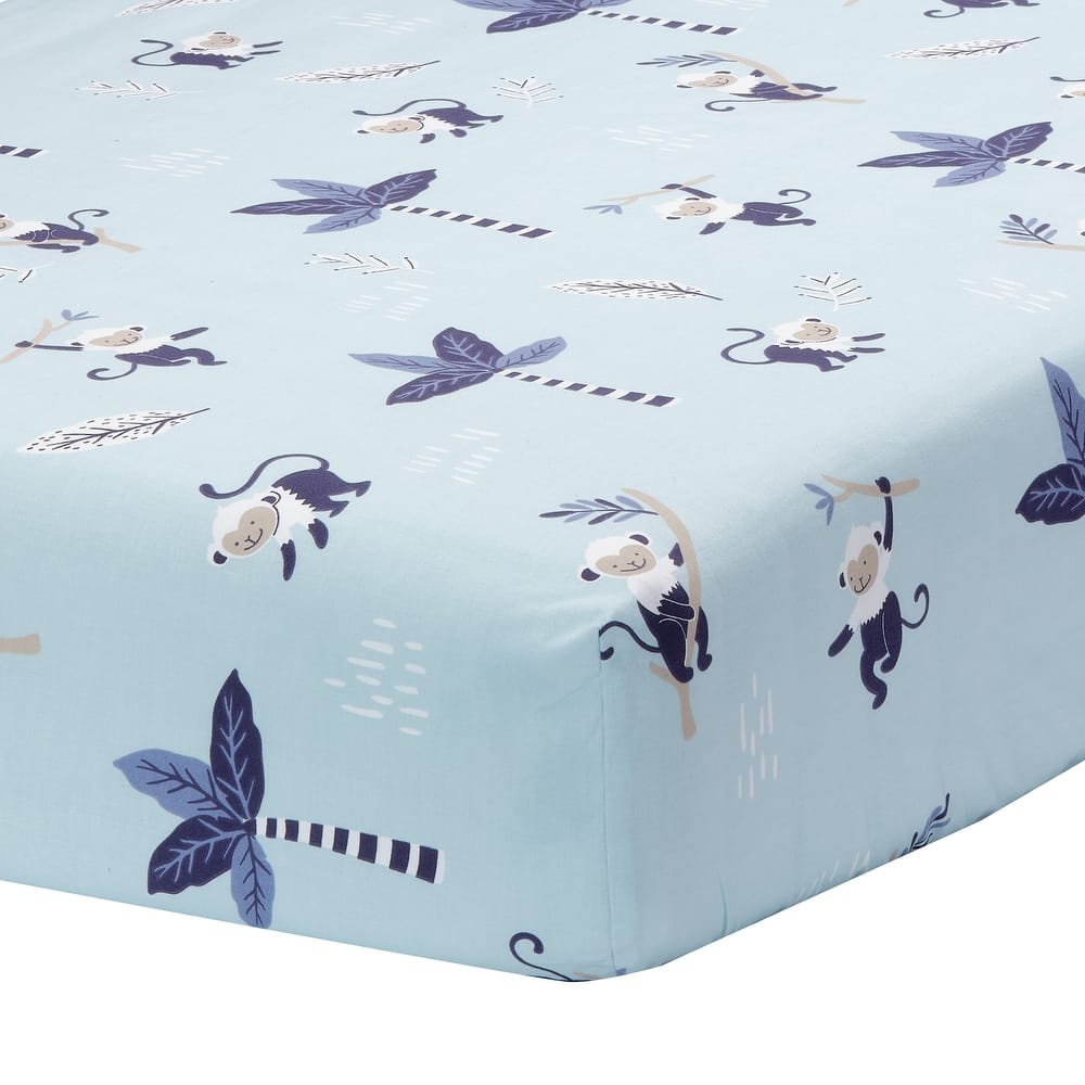 Cubrecolchón celeste con estampado de monos para bebé